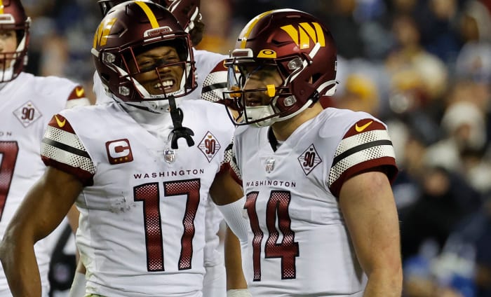 Washington Commanders quarterback Sam Howell (14) and receiver Terry McLaurin (17) celebrate a play in Week 18.